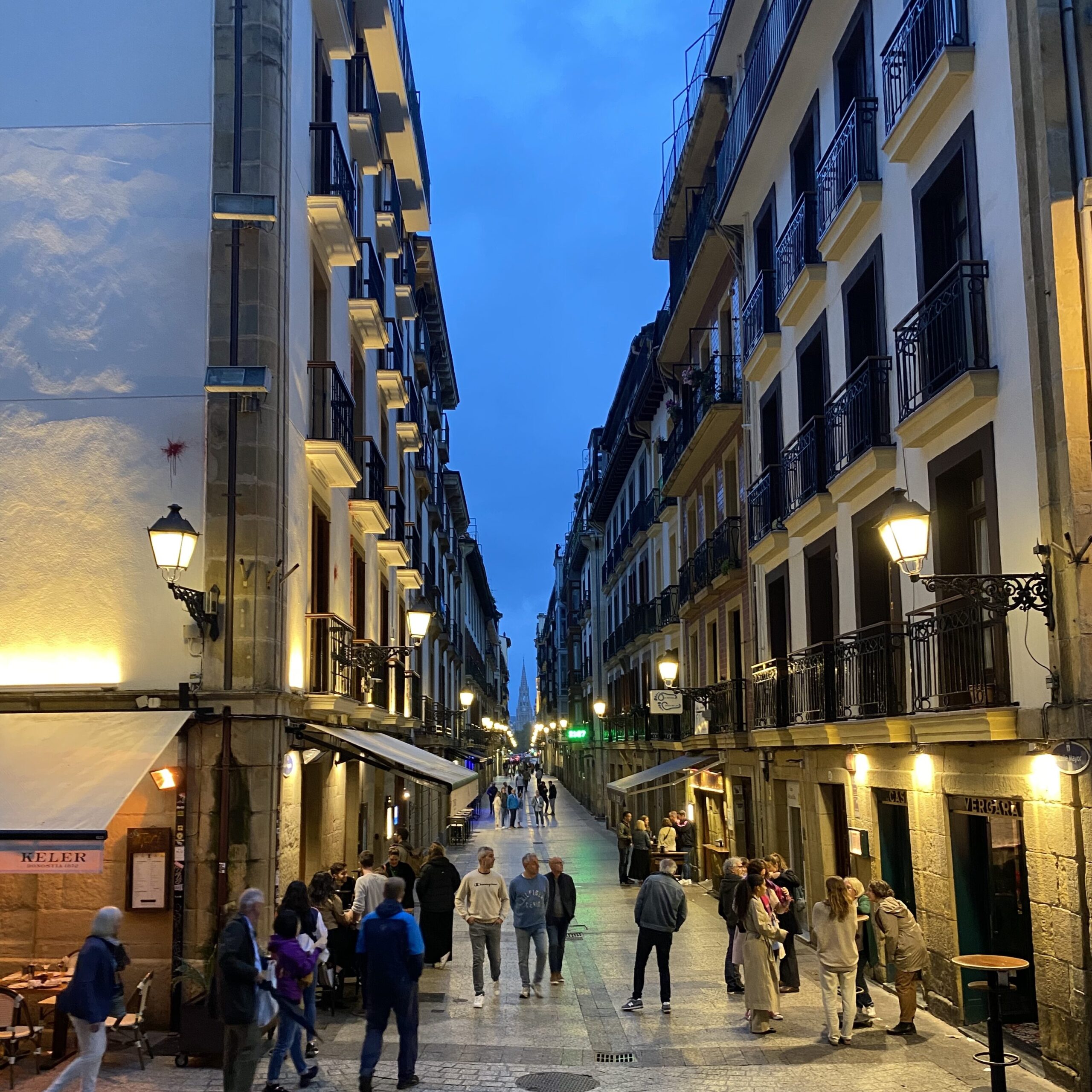 A small city street at night.